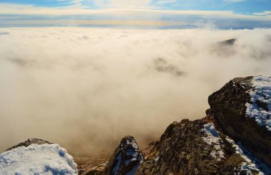 clouds and snow-capped mountains of Belmeken in Bulgaria