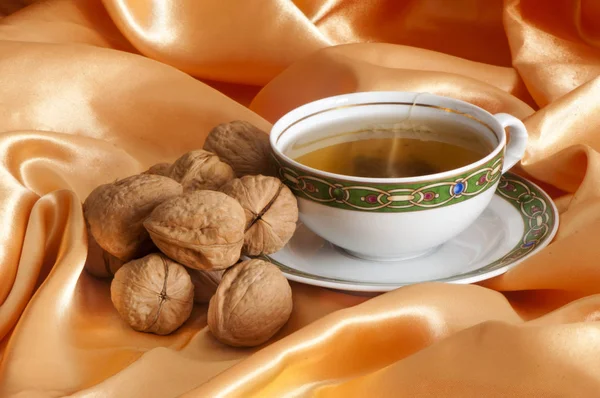 Ginger tea and orange with nuts — Stock Photo, Image