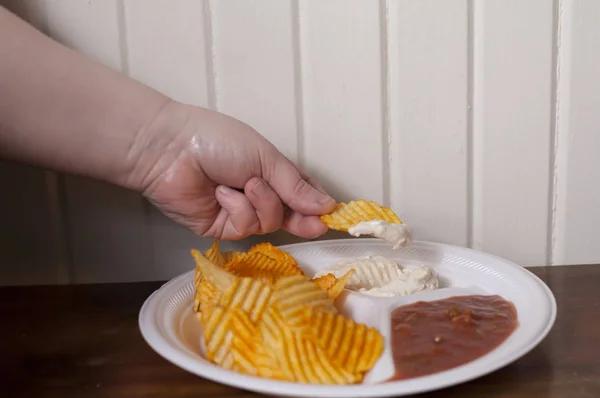 Grabbing a Chip — Stock Photo, Image