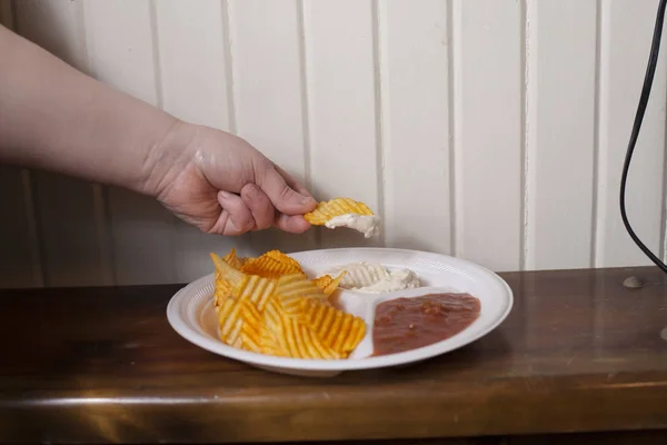 Grabbing a Chip — Stock Photo, Image