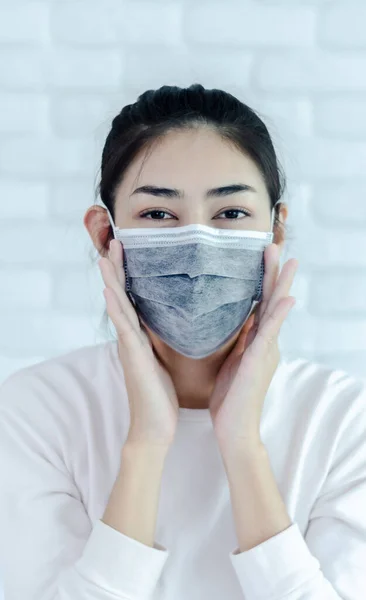 Asian girl wearing a black mask.Nose mask protects against dust on the face of  women.Blurred image for background use.