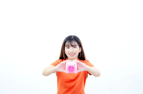 Piękne Azjatki Noszą Pomarańczowe Koszule Niebieskie Spodnie Różową Świnką Bank — Zdjęcie stockowe