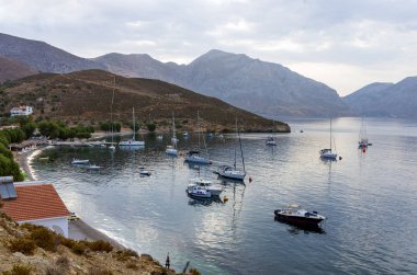Lovely scenery by the sea in Emporios village, Kalymnos island, Dodecanese, Greece clipart