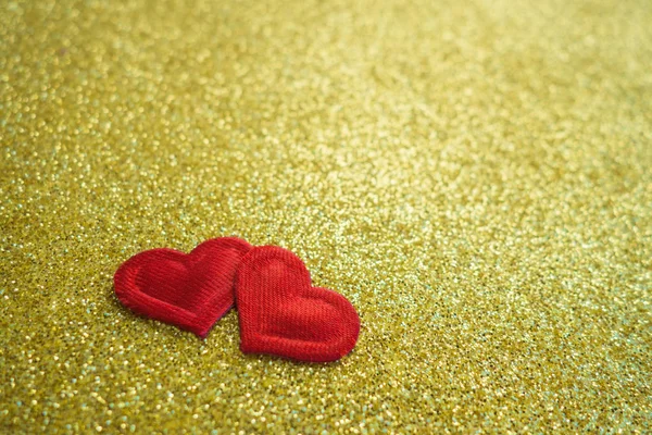 Two small red handmade hearts on bright gold bokeh background Vintage style. Happy Valentines Day. Copy space. — 스톡 사진