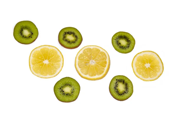 Kiwi and lemon circles on a white background — Stock Photo, Image