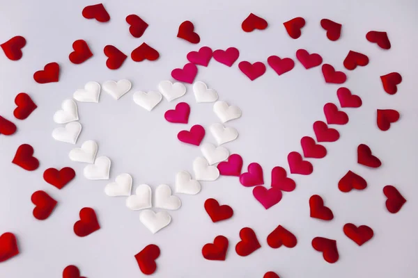 Two hearts white and red on a white background. Valentine's Day. — Stock Photo, Image