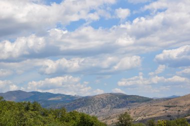 Beautiful clouds on a blue sky in the mountains. Crimean mountai