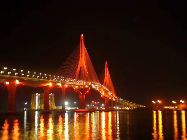 illumination at dusk of the bridge of the Constitution, called La Pepa, on the coast of the capital city of Cdiz. Andalusia. Spain. Europe. October 27, 2019