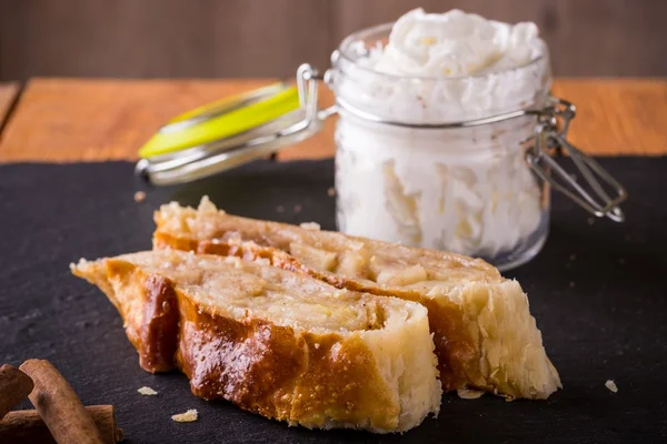 Two portions of apple pie strudel on slate stone — Stock Photo, Image