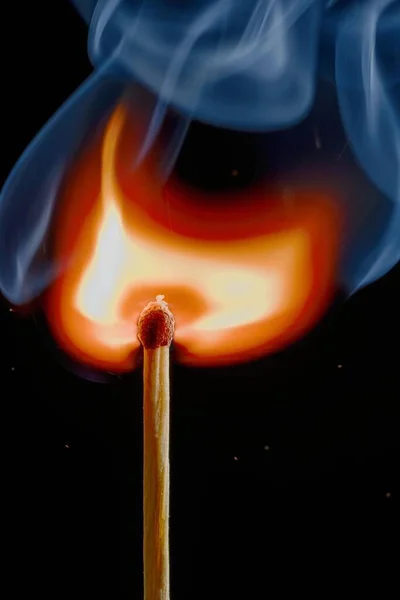 Safety match on black background with flaming head — ストック写真