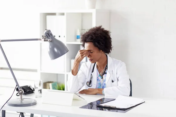 Woman doctor in ambulance office with stethoscope