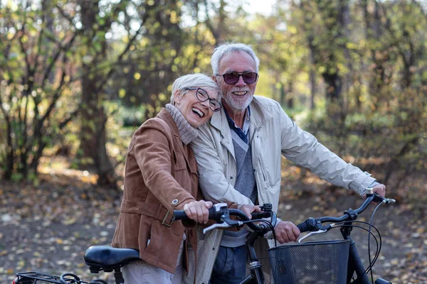stock image Old mature couple with bikes in park