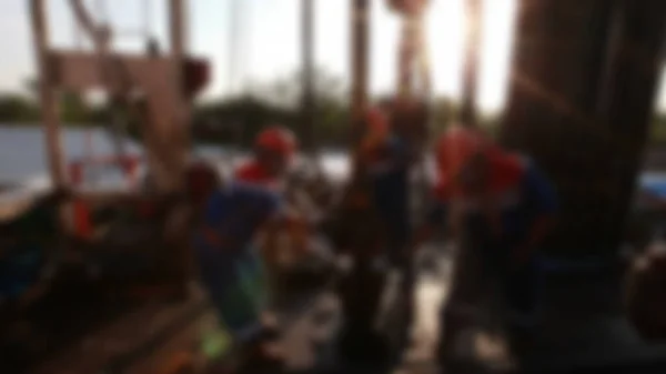 Blurry View Oil Workers Check Oil Pump Roustabouts Doing Dirty — Stockfoto