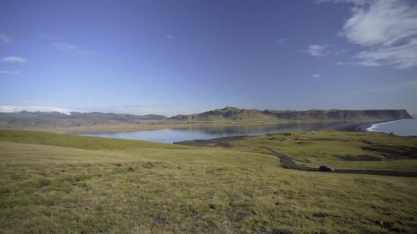 Reynisfjara Black Sand Beach. View from the hill to the black beach and the ocean — Stock Video