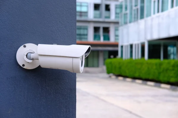 Closeup of CCTV camera on a wall.