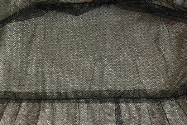 Abstract achtergrond textuur van zwarte tule, glanzend — Stockfoto