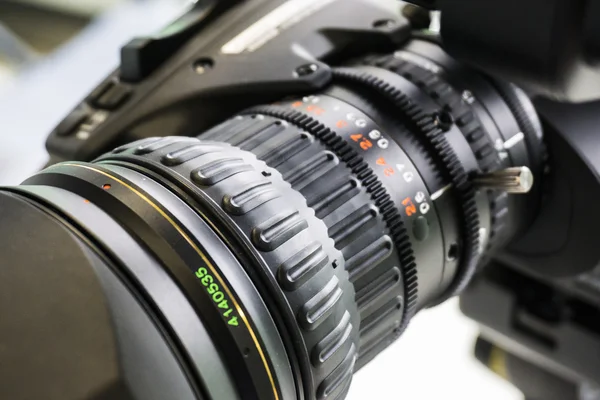 Video camera lens in TV studio - focus on camera aperture