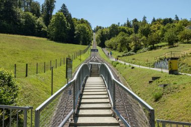 The Gurten funicular lets you to reach a paradise of green meadows and breathtaking views of the snowy caps of the Bernese Oberland region, the sparkling Aare river and the city of Bern, Switzerland
