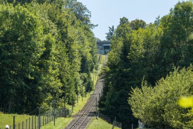 The Gurten funicular lets you to reach a paradise of green meadows and breathtaking views of the snowy caps of the Bernese Oberland region, the sparkling Aare river and the city of Bern, Switzerland