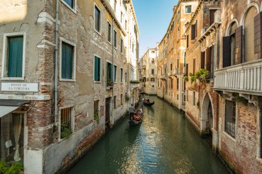 VENICE, ITALY - August 03, 2019: Narrow pedestrian streets of Venice bitween the channels. Some quiet places almost without people.