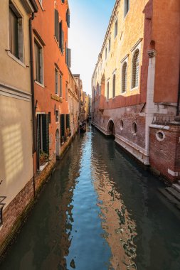 VENICE, ITALY - August 03, 2019: Narrow pedestrian streets of Venice bitween the channels. Some quiet places almost without people.