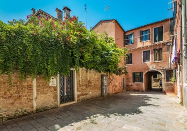 VENICE, ITALY - August 03, 2019: Narrow pedestrian streets of Venice bitween the channels. Some quiet places almost without people.