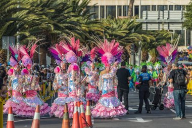 SANTA CRUZ DE TENERIFE, SPAIN - FEBRUARY 25, 2020: Coso parade - along the Avenida de Anaga, official end of Carnival. Again march carnival groups, floats, decorated cars and the Carnival Queens.