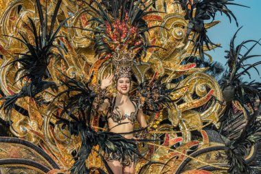 SANTA CRUZ DE TENERIFE, SPAIN - FEBRUARY 25, 2020: The Coso Parade - Final procession of the Carnival - second most popular and internationally known. One of the Carnival Queen candidate.
