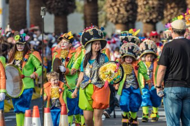SANTA CRUZ DE TENERIFE, SPAIN - FEBRUARY 25, 2020: Coso parade - along the Avenida de Anaga, official end of Carnival. Again march carnival groups, floats, decorated cars and the Carnival Queens.