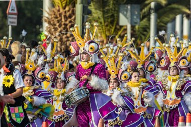 SANTA CRUZ DE TENERIFE, SPAIN - FEBRUARY 25, 2020: Coso parade - along the Avenida de Anaga, official end of Carnival. Again march carnival groups, floats, decorated cars and the Carnival Queens.