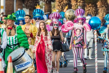 SANTA CRUZ DE TENERIFE, SPAIN - FEBRUARY 25, 2020: Coso parade - along the Avenida de Anaga, official end of Carnival. Again march carnival groups, floats, decorated cars and the Carnival Queens.