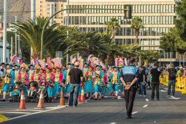 SANTA CRUZ DE TENERIFE, SPAIN - FEBRUARY 25, 2020: Coso parade - along the Avenida de Anaga, official end of Carnival. Again march carnival groups, floats, decorated cars and the Carnival Queens.