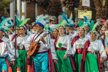SANTA CRUZ DE TENERIFE, SPAIN - FEBRUARY 25, 2020: Coso parade - along the Avenida de Anaga, official end of Carnival. Again march carnival groups, floats, decorated cars and the Carnival Queens.