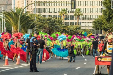 SANTA CRUZ DE TENERIFE, SPAIN - FEBRUARY 25, 2020: Coso parade - along the Avenida de Anaga, official end of Carnival. Again march carnival groups, floats, decorated cars and the Carnival Queens.