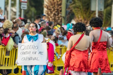 SANTA CRUZ DE TENERIFE, SPAIN - FEBRUARY 25, 2020: Coso parade - along the Avenida de Anaga, official end of Carnival. Again march carnival groups, floats, decorated cars and the Carnival Queens.