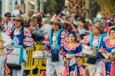 SANTA CRUZ DE TENERIFE, SPAIN - FEBRUARY 25, 2020: Coso parade - along the Avenida de Anaga, official end of Carnival. Again march carnival groups, floats, decorated cars and the Carnival Queens.