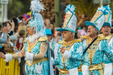 SANTA CRUZ DE TENERIFE, SPAIN - FEBRUARY 25, 2020: Coso parade - along the Avenida de Anaga, official end of Carnival. Again march carnival groups, floats, decorated cars and the Carnival Queens.