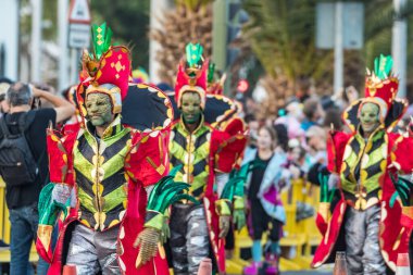 SANTA CRUZ DE TENERIFE, SPAIN - FEBRUARY 25, 2020: Coso parade - along the Avenida de Anaga, official end of Carnival. Again march carnival groups, floats, decorated cars and the Carnival Queens.
