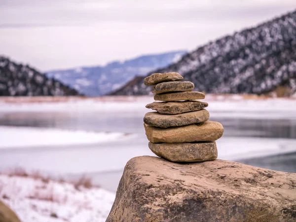 Isolated Rock Cairn with Frozen Lake Background — Stock Photo, Image