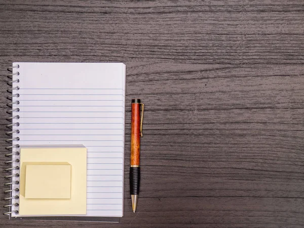 Desk, Spiral Notebook, Sticky Notes, Pen on Desk