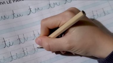 Child hand close up writing,doing primary school homework,education school 4k