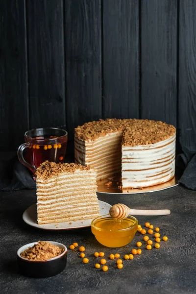 Homemade honey cake on a dark background top view copy space.