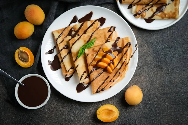 Crepes Chocolate Sauce Fruits Mint Dark Background Top View — Stock Photo, Image