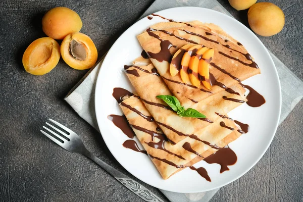 Crepes Chocolate Sauce Fruits Mint Dark Background Top View — Stock Photo, Image