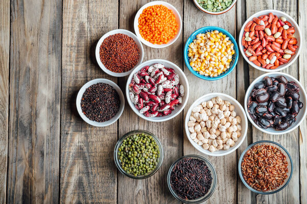 Super food. Seeds and beans assortment on a rustic background copy space. Vegetarians. Top view 