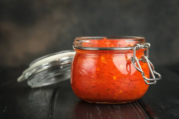 Traditional Spicy Harissa Sauce Glass Jar Dark Background Spices Maghreb — 스톡 사진