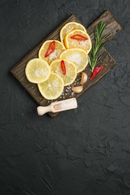 Ingredients for salted lemons on a dark background. Moroccan cuisine.