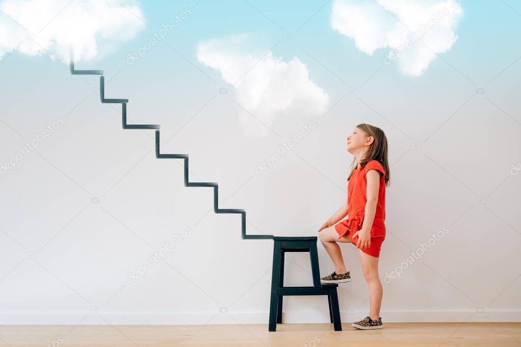little girl begins to climb the stairs that lead to heaven - life future dreams targets goals illusions planning grow motivation concept