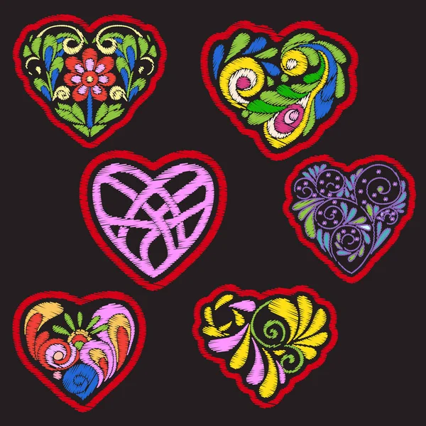 Embroidery with patterned love heart on black background — Stock Vector