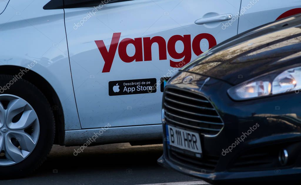 Bucharest, Romania - December 09, 2019: A car with the Yango logo of the multinational Yandex.Taxi BV belonging to Russian multinational corporation Yandex N.V. is seen on a street in Bucharest.